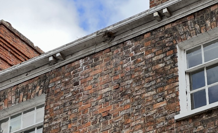 Rotting timber guttering | climate change | heritage buildings