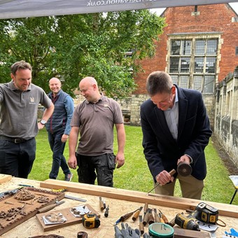 Trustees and family of John Bowes Morrell are given a demonstration in traditional craft skills